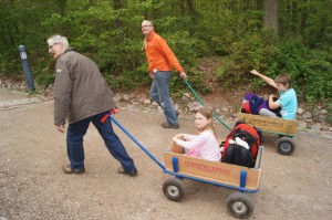 Chris and Joseph pulling Matthew and Sophie