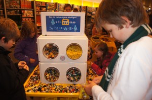 Matthew making his mini figures in the lego store